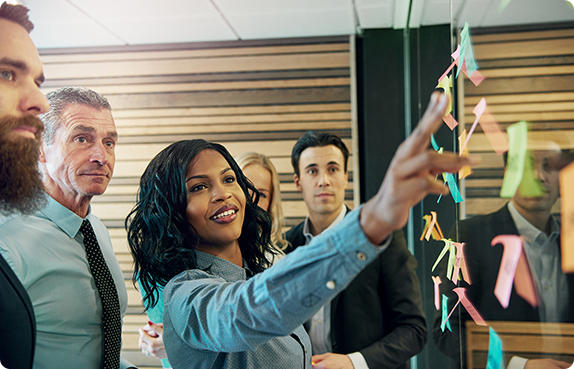 A team planning out on a board with sticky notes