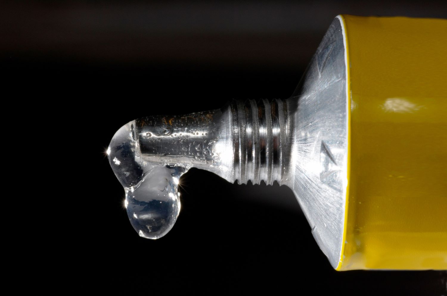 Close up of the end of a glue bottle