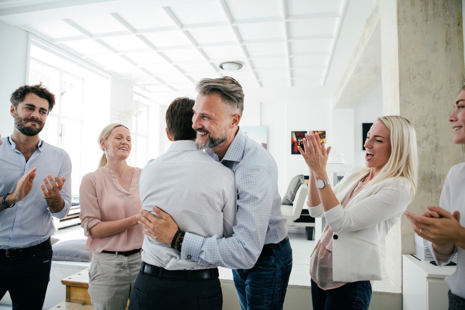 Nepotisms in Ministry Work feature coworkers hugging each other