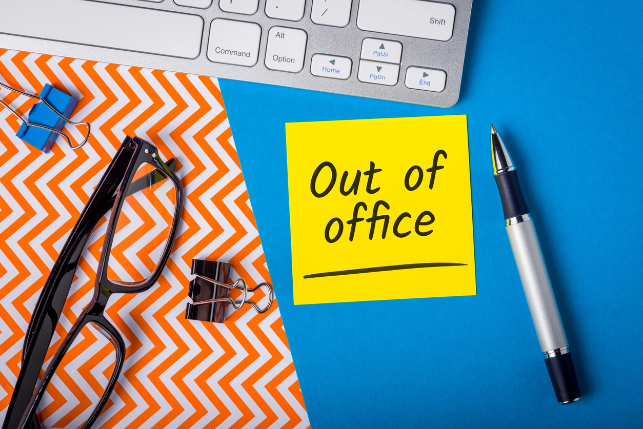 Sticky note that reads: out of office