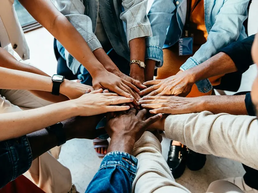 Group of hands on top of each other